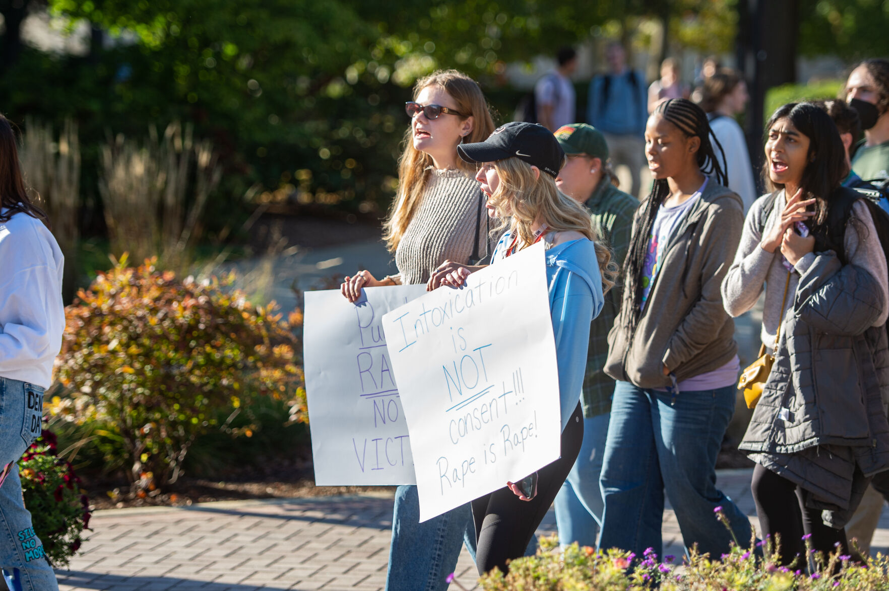 Students rally in support of MeToo movement, Students hold signs while chanting